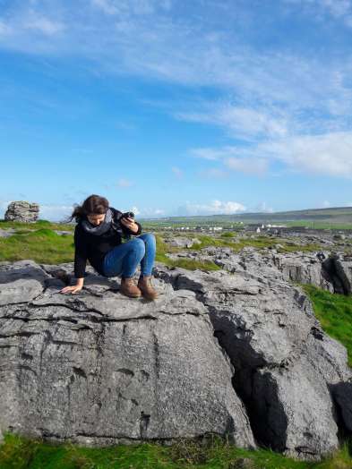 Beautiful nature in green Ireland, climbing on the rocks